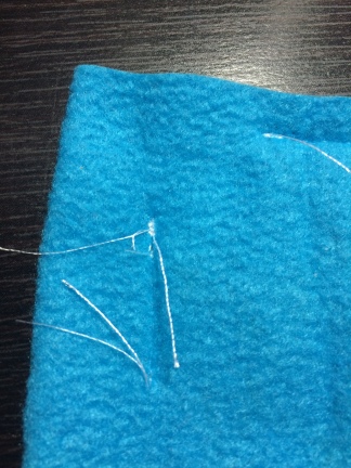 Another large clump of stitching caused by improper back stitching. If this were on the outside of a pouch, it would be raised and cause a snagging hazard.